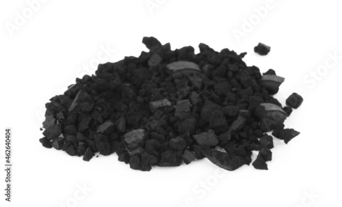 Pile of crushed activated charcoal pills on white background. Potent sorbent
