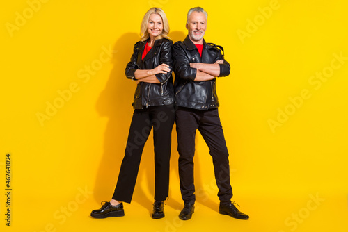Full length body size view of attractive cheery grey-haired lovers folded arms isolated over bright yellow color background
