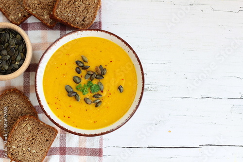 Homemade pumpkin soup sprinkled with pumpkin seeds