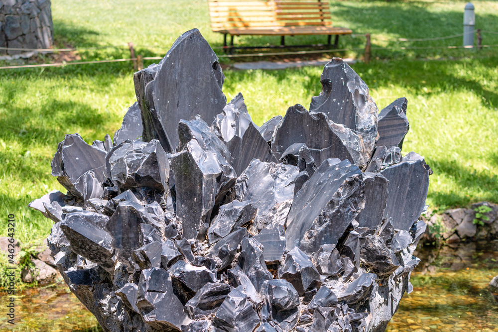 Obraz premium Black stone obsidian or volcanic glass. It was used by shamans of the Aztec tribe for sacrifices and rituals