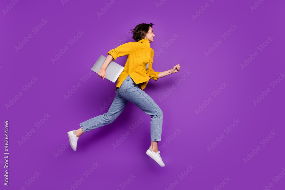 Full length body size profile side view of nice cheerful girl jumping running isolated over bright violet purple color background