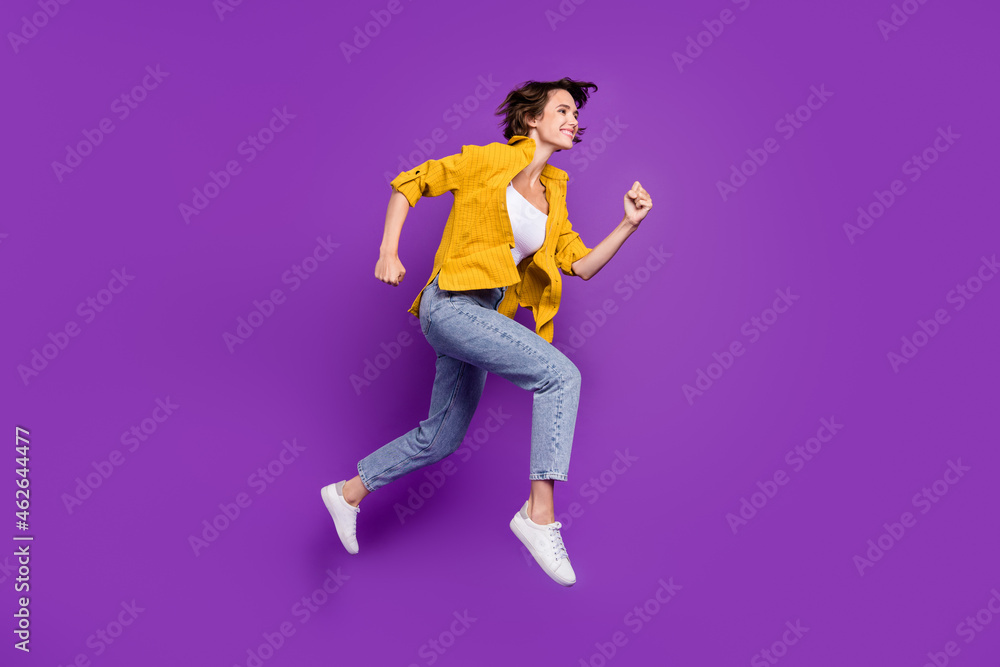 Full length body size view of nice cheerful motivated girl jumping running isolated over bright violet purple color background