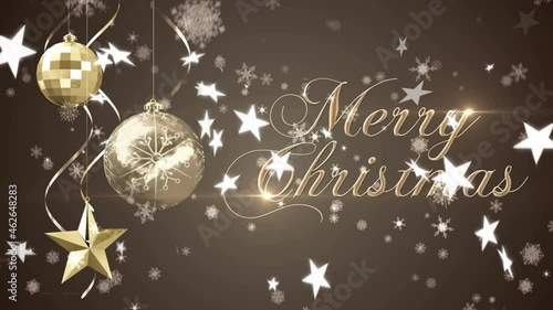 Snowflakes falling over merry christmas text and hanging christmas decorations on brown background photo