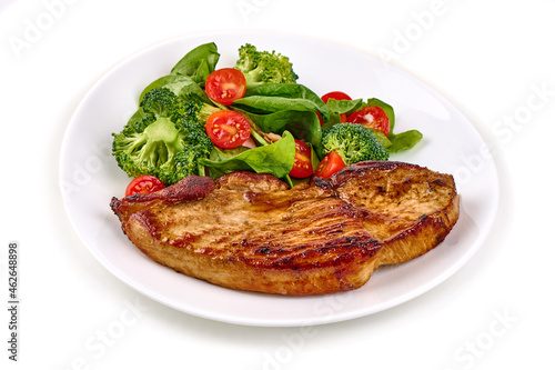 Grilled juicy steaks bbq with vegetable salad, isolated on white background.