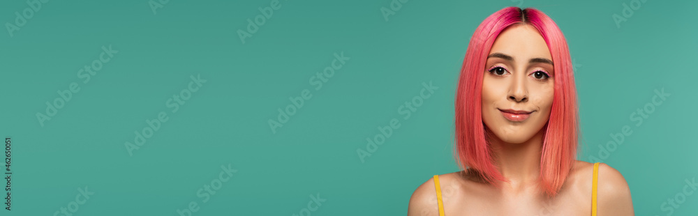 pretty young woman with pink dyed hair smiling isolated on blue, banner pretty young woman with pink dyed hair smiling isolated on blue, banner
