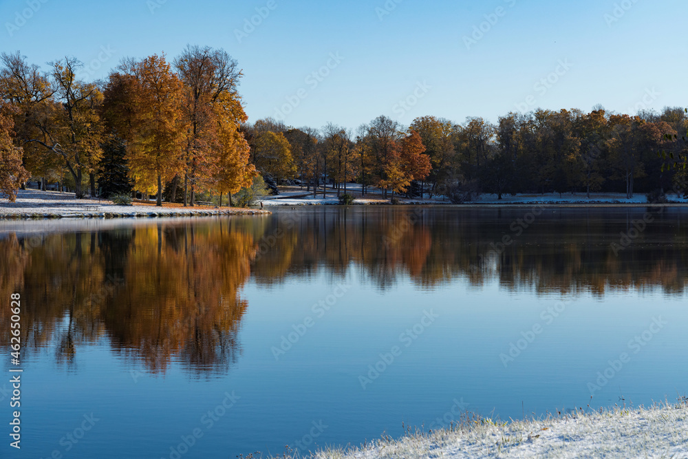 Still mirrored  lake in autumn with beautiful reflections 
