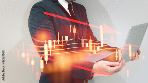 Double exposure of young business man and digital number of stock market background to represent successful in investment marketing. Find out the best solution in business and financial as concept. 
