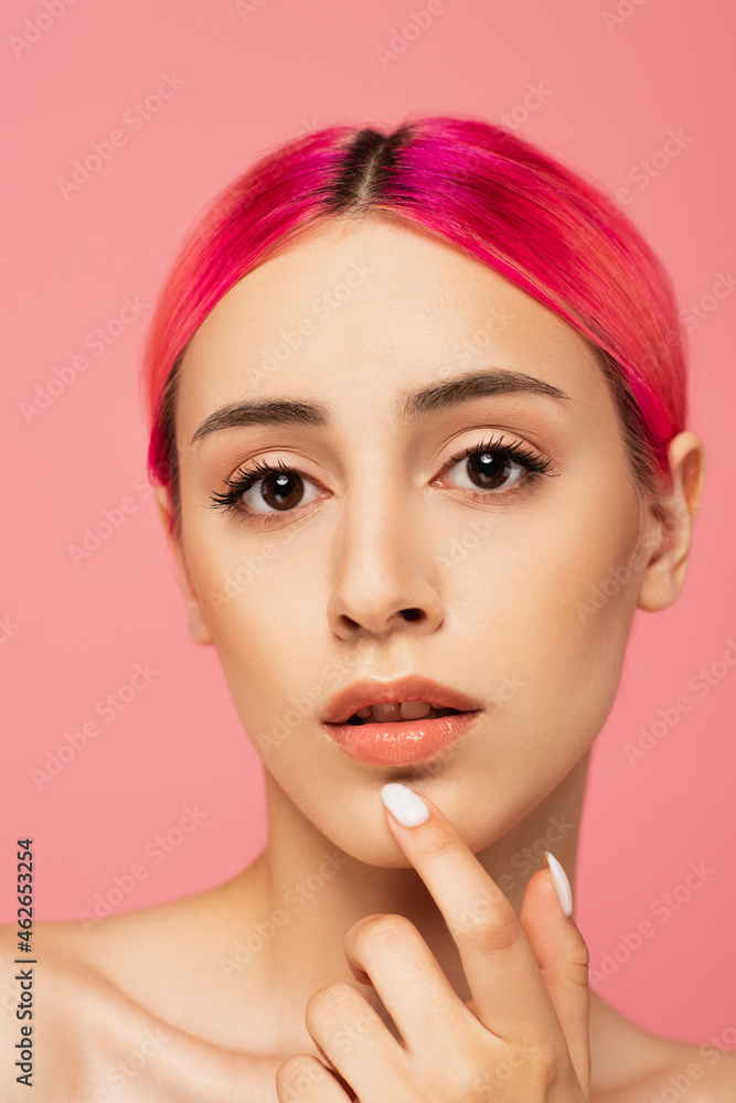 pretty young woman with colorful hair and perfect skin looking at camera isolated on pink pretty young woman with colorful hair and perfect skin looking at camera isolated on pink