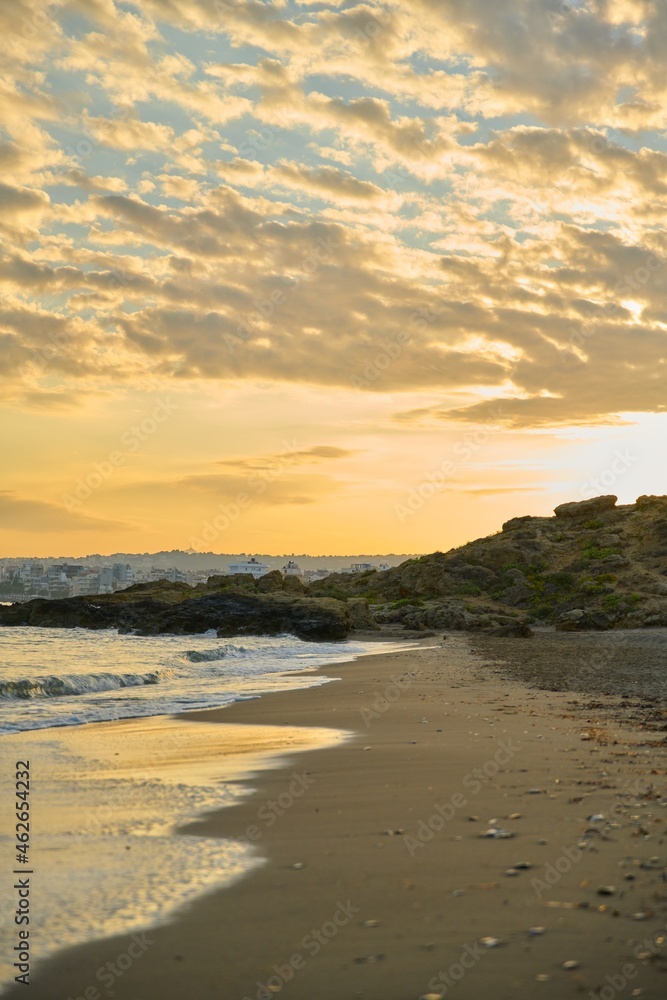 Morning, sunrise at sea, natural seascape, the Greek city of Chania Crete on the horizon
