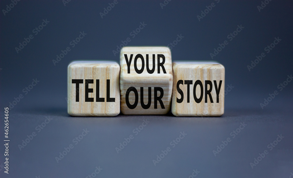 Tell our or your story. Turned wooden cubes and changed words tell our story to tell your story. Beautiful grey background, copy space. Business, storytelling and our or your story concept. - obrazy, fototapety, plakaty 