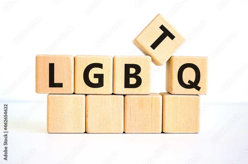 LGBTQ symbol. Concept word acronym 'LGBTQ' on wooden cubes. Beautiful white table, white background. LGBTQ concept, copy space. LGBTQ symbol. Concept word acronym 'LGBTQ' on wooden cubes. Beautiful white table, white background. LGBTQ concept, copy space.