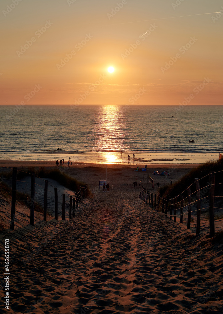 A vertical shot of a beautiful sunset at the beach