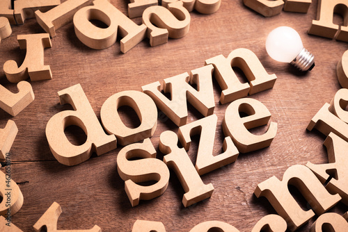 Photos Downsize wood word arranged on the table
