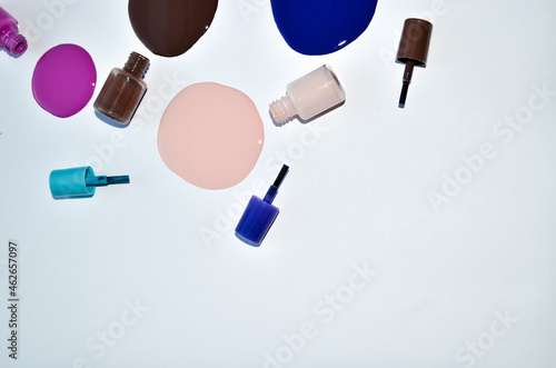 Nail polish (enamel) mixed multicolor samples, isolated on white background