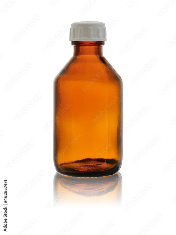 An empty medical bottle made of brown glass, closed with a lid. Isolated on a white background with reflection