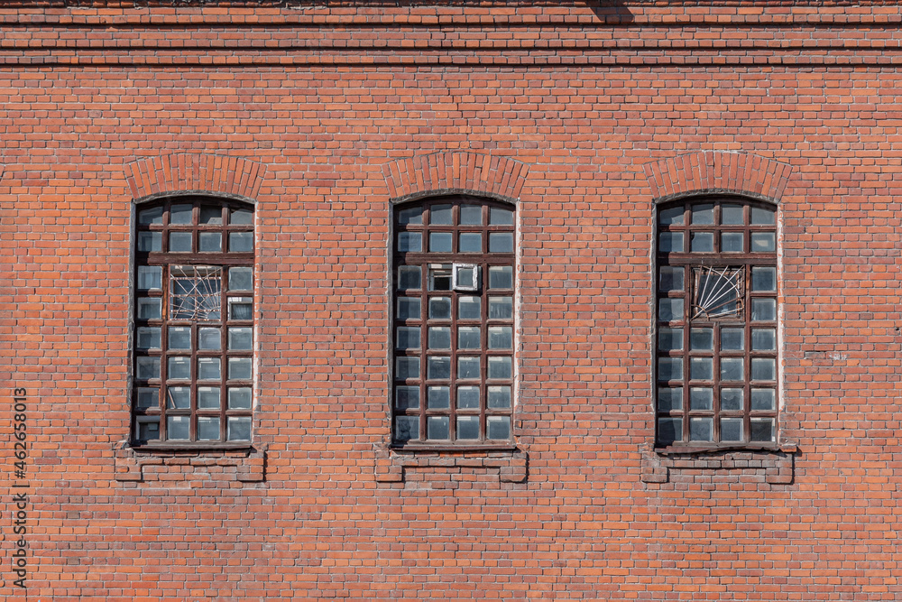 Fototapeta premium Old brick wall with windows background. Psychiatric hospital No. 3, the city of Novosibirsk 