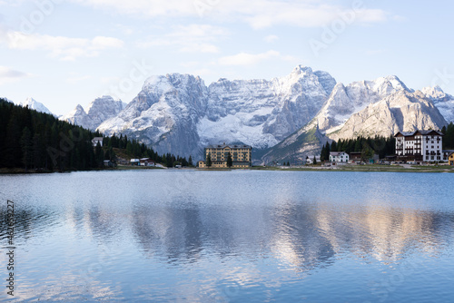 Reflection of the snowy mountain in the Misurina lake  in Dolomites  Italy.
