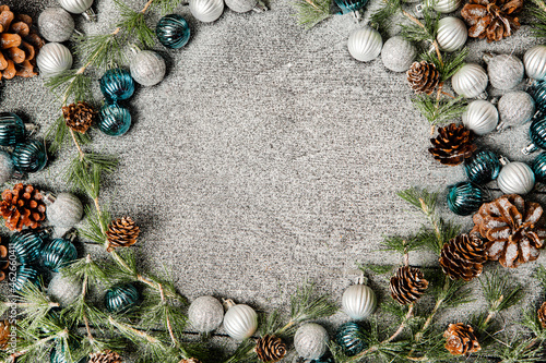 Christmas frame background with copy space. Merry Christmas and Happy New Year banner with tree balls and pine cones.