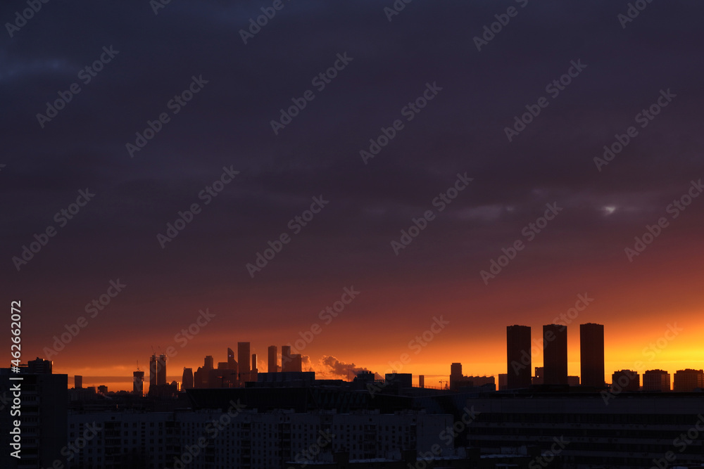 Silhouettes of Moscow skyscrappers on the horizon on the sunset