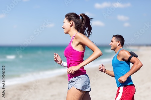 Couple young friends strong sporty sportswoman sportsman training run