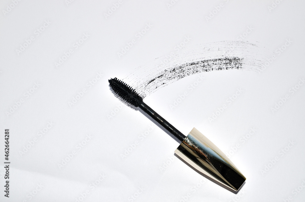 Naklejka premium Smudged black mascara isolated on white background. Cosmetic product swatch. Paint brush stroke