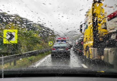 Obraz na płótnie Car in traffic jam with rain covered windshield