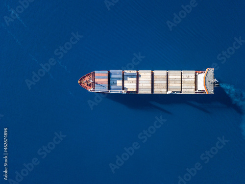 Aerial view on container ship shipping cargo. Export, import and logistic