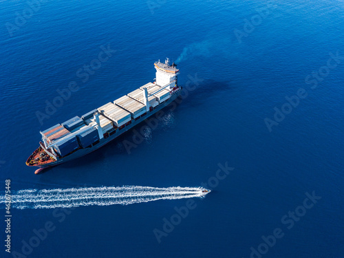 Aerial view on boat and container ship. Shipping cargo. Export, import and logistic © Anton Tolmachov