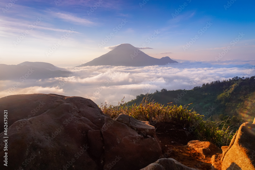 Beautiful view of Sikunir, Dieng. Mountain view with sea of clouds. Perfect for natural background or wallpaper. 