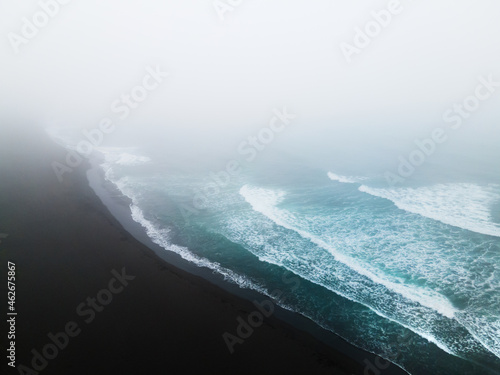 Pacific ocean coast with black volcanic sand. Aerial drone view. Halaktyrsky beach in Kamchatka, Russia. Summer nature background