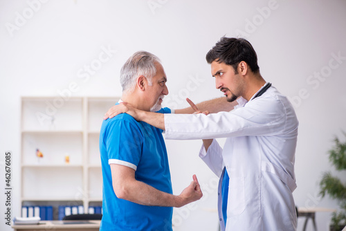 Old male patient visiting young male doctor