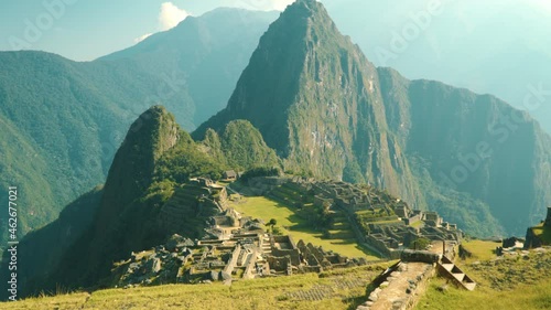Machu Picchu citadel illuminated by the morning sun, a beautiful view of the Inca settlement. No people.