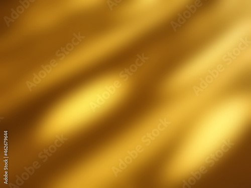 Golden blurred background with soft shadows and highlights
