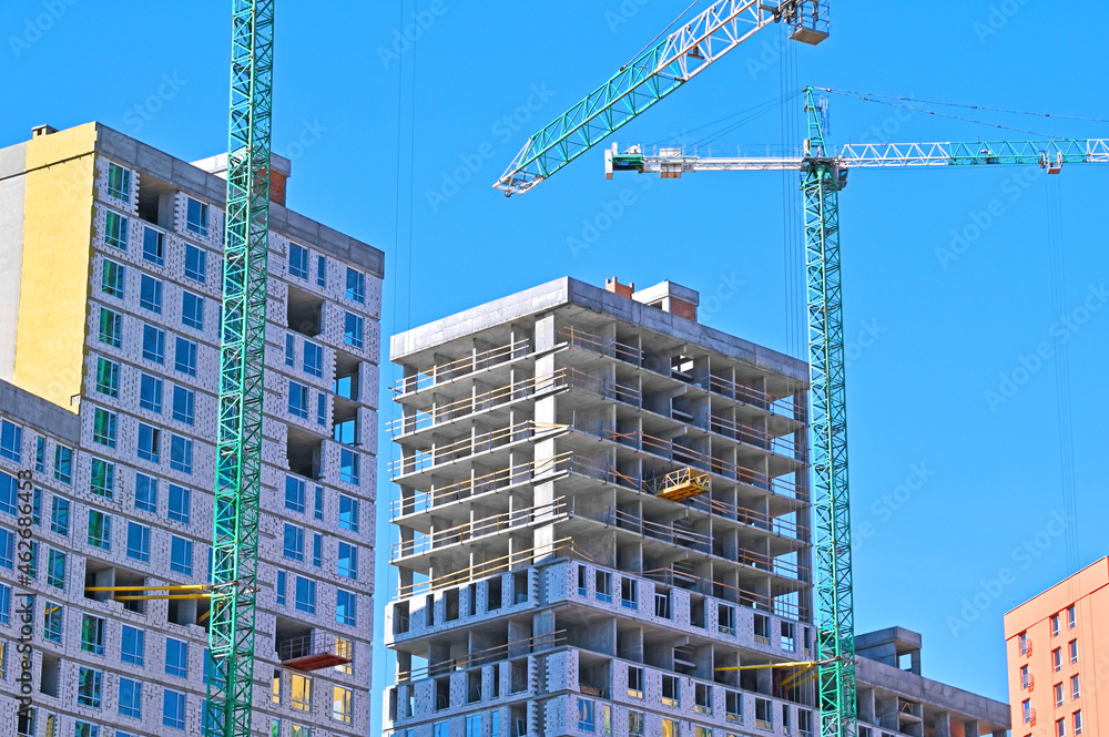 Crane and highrise construction site Crane and highrise construction site