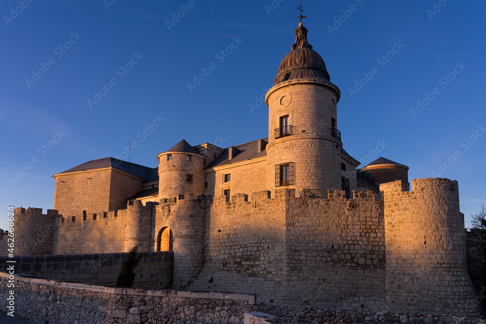 SIMANCAS, SPAIN - MARCH 07, 2020: Historical Archive castle of Simancas in Valladolid at sunset with blue sky, Castilla y Leon, Spain.