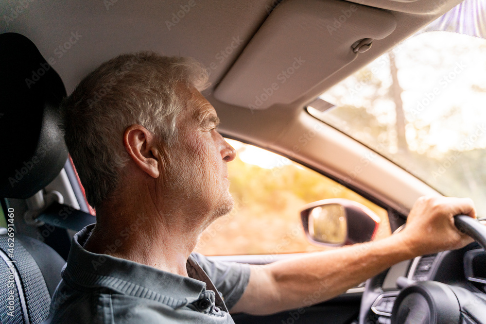 Close up of a senior man sitting in his car Close up of a senior man sitting in his car