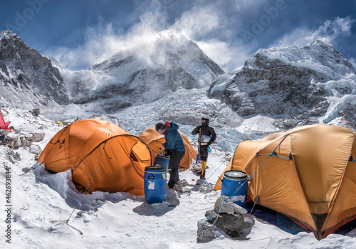 Nepal, Solo Khumbu, Everest Base Camp, Two mountaineers preparing tents photo