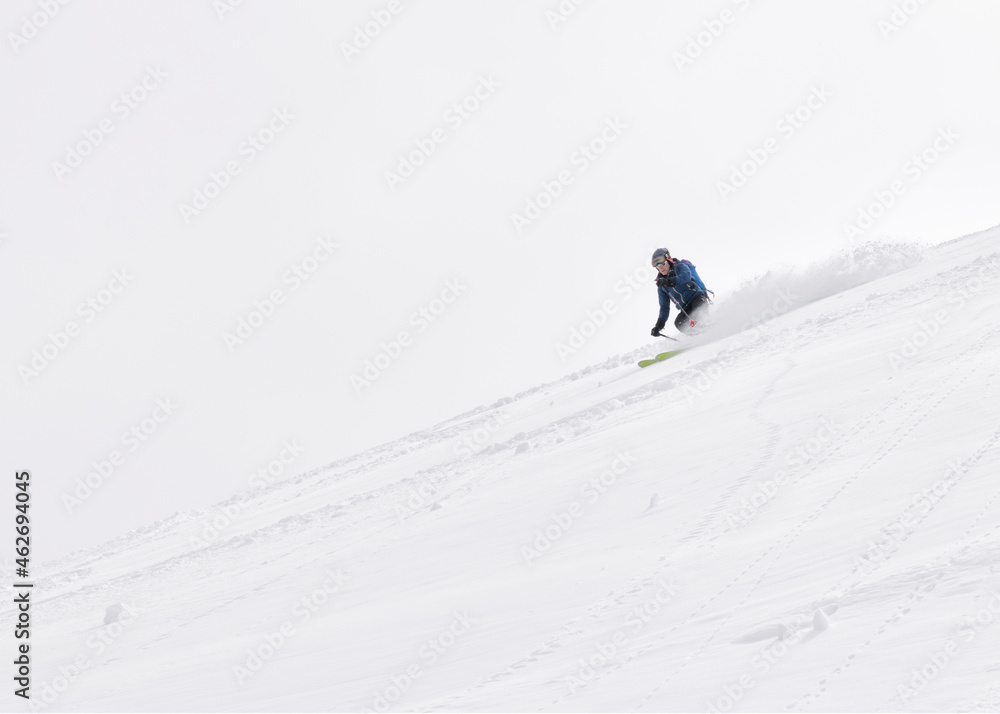 Georgia, Caucasus, Gudauri, man on a ski tour riding downhill Georgia, Caucasus, Gudauri, man on a ski tour riding downhill