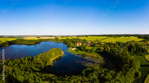 Germany, Mecklenburg-Western Pomerania, Mecklenburg Lake District, Schwinkendorf, Aerial view of Ulrichshuser See and Ulrichshusen Castle