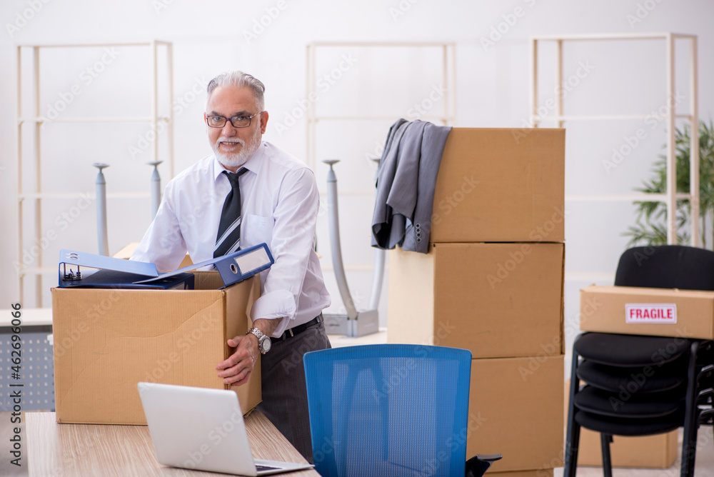 Old male employee in relocation concept Old male employee in relocation concept