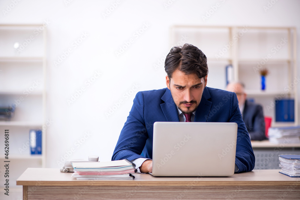 Two male colleagues working in the office Two male colleagues working in the office
