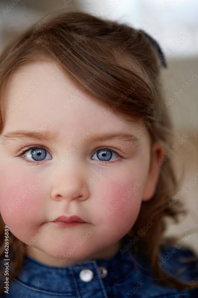 Portrait of toddler girl with blue eyes and red cheeks Portrait of toddler girl with blue eyes and red cheeks