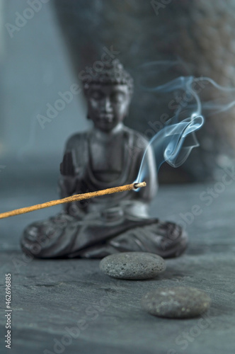 Joss stick and Buddha figurine