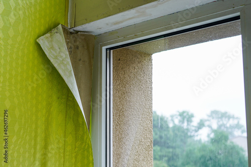 wallpaper peeled off due to moisture or poor quality gluing