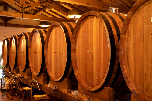 White  rose and red wine in barrels for sale in wine cellars in Italy