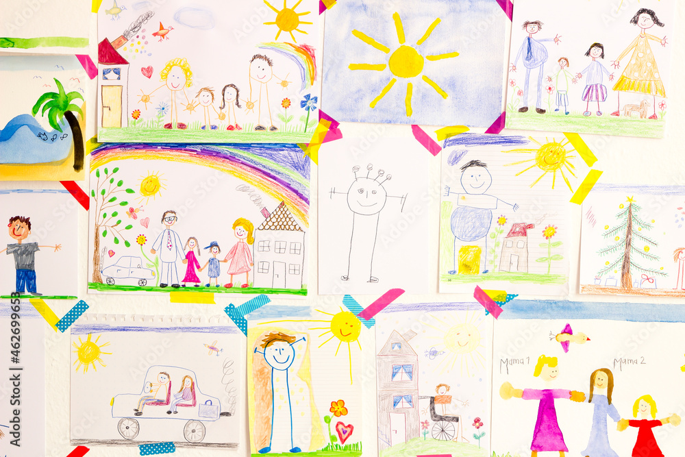 Child's drawings hanging on wall Child's drawings hanging on wall