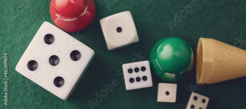 Colored board game figures with dice. Board games concept