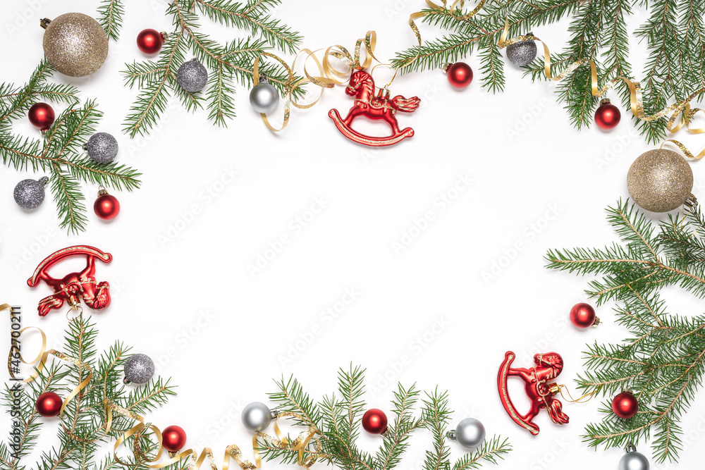 Christmas or New Year white background with fir branches and decorative toys. Top view, empty space Christmas or New Year white background with fir branches and decorative toys. Top view, empty space