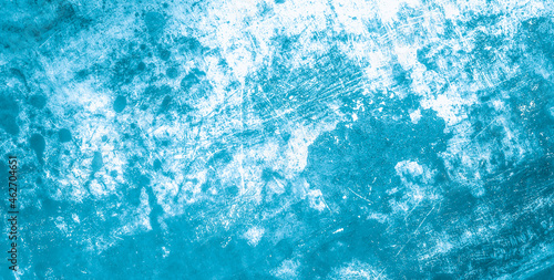 Blue grunge surface. Aged old material. Abstract cracked fabric. Distressed grunge texture of metal. Vintage grainy splash. Weathered stains wallpaper. Scratched grunge background.