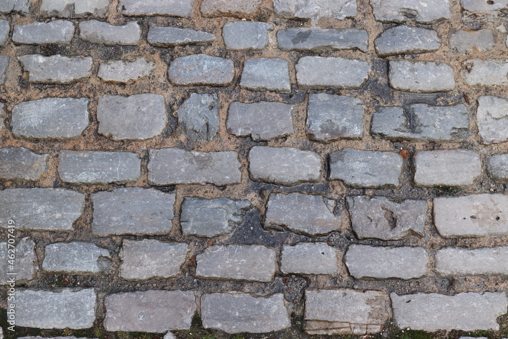 Obraz premium Hintergrund Pflastersteine. Kopfsteinpflaster.